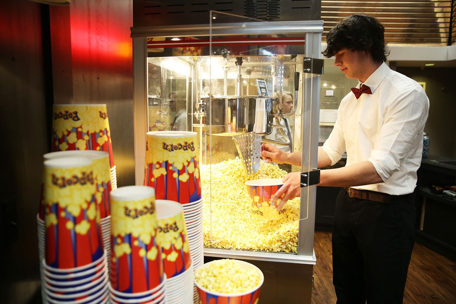 Andy Wages scoops another layer of popcorn